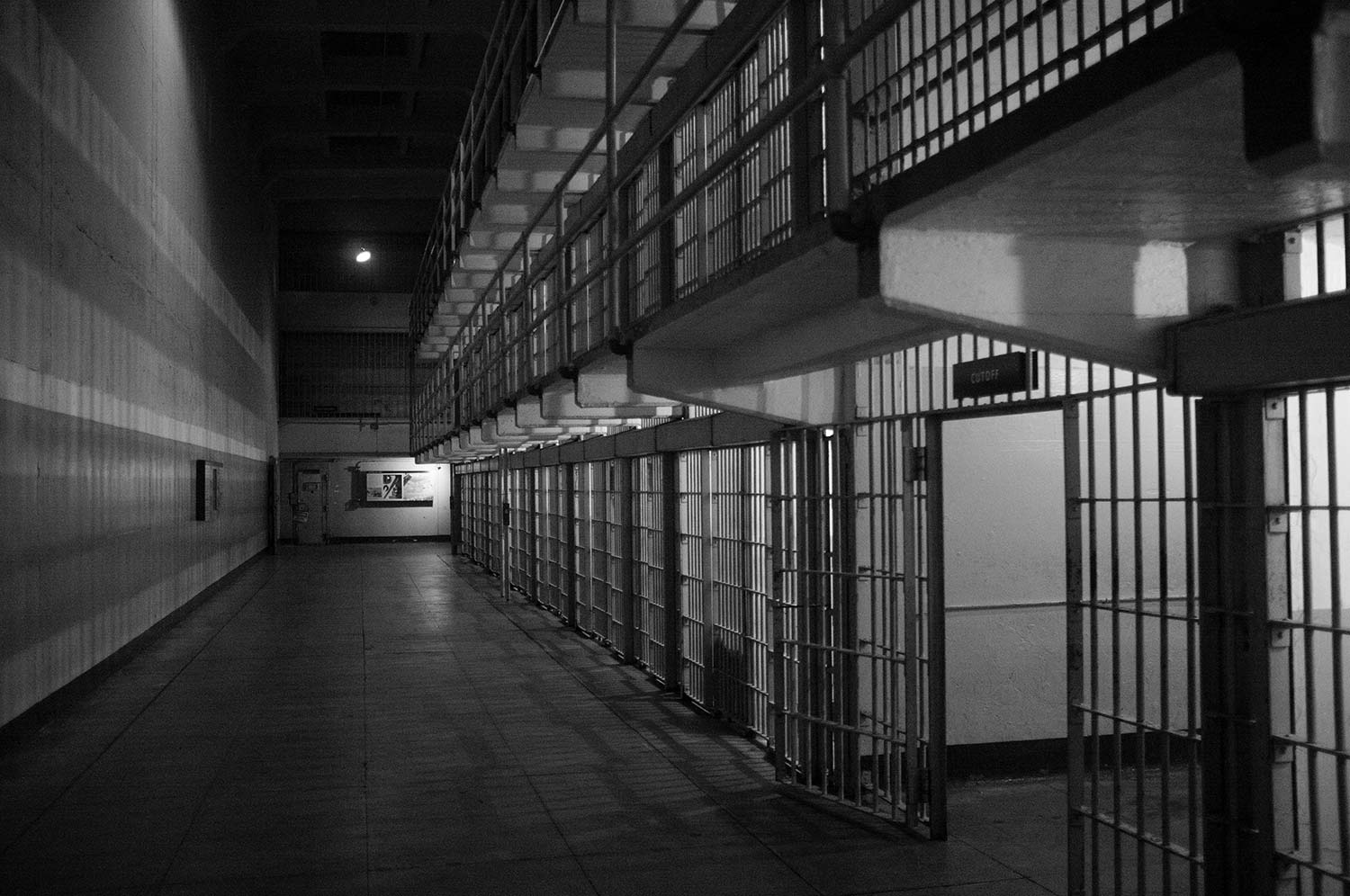 inside a jail hallway, black and white
