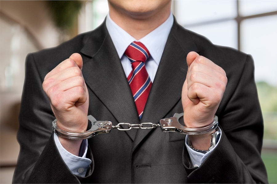 man's hands in handcuffs